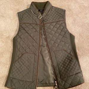 Green vest with brown accents
